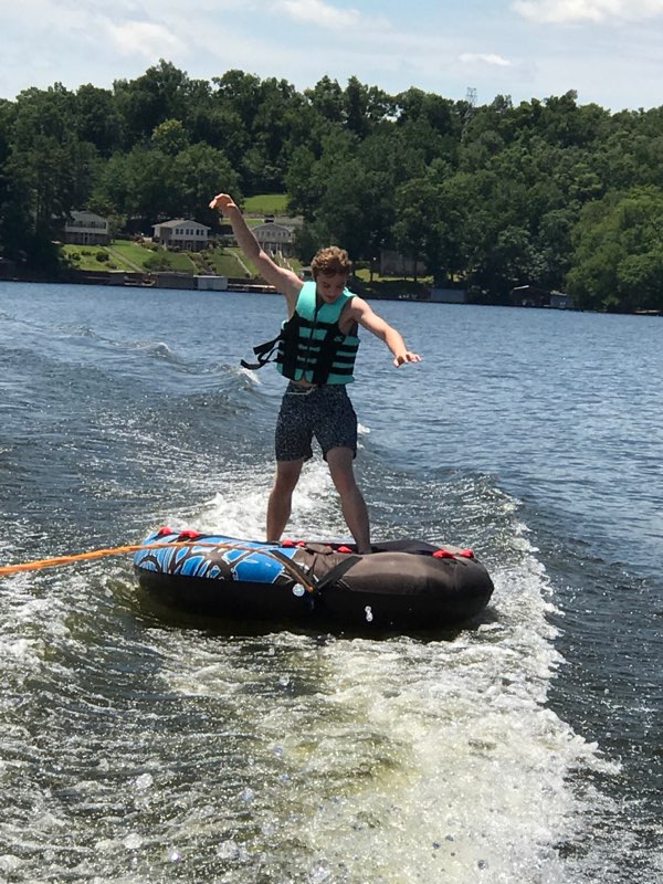 A person skiing wearing a life jacket